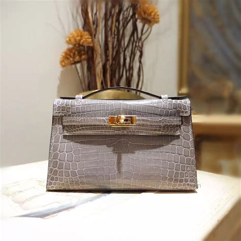 hermes kelly pochette croc price|Hermes kelly bag price euro.